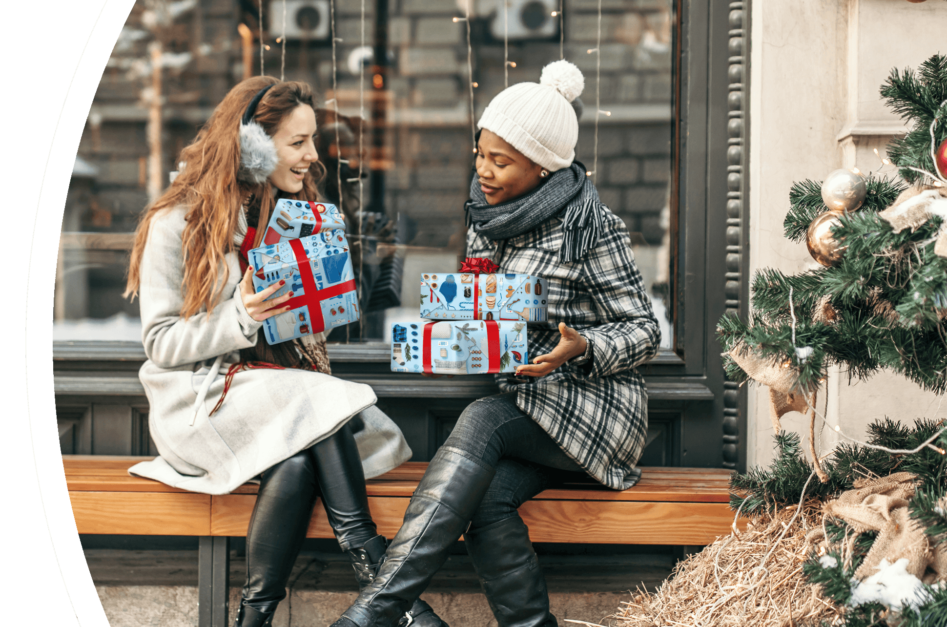 Two women exchange gifts in front of a store.